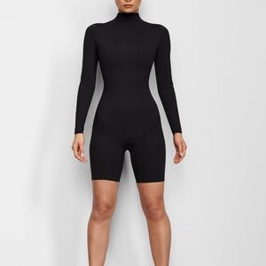 Brand new SKIMS LONG SLEEVE MID THIGH ONESIE